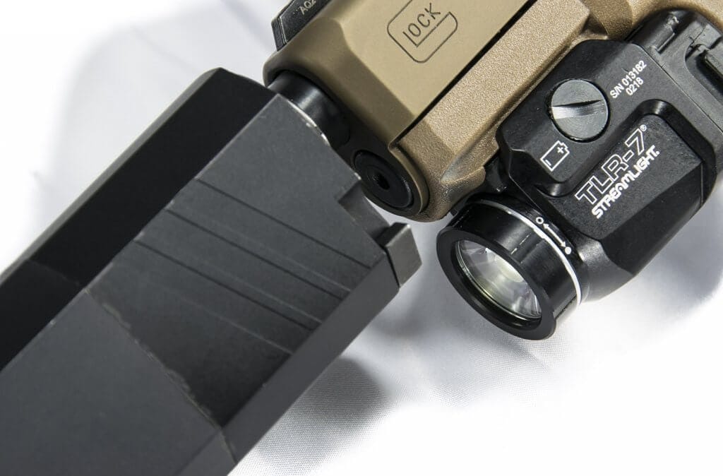TLR-7 mounted below a a large suppressor. TLR-7 mounted below a a large suppressor.