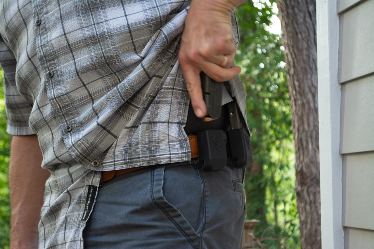 With a shirt for concealment, you'll need to hold the shirt out of the way while retrieving the magazine.