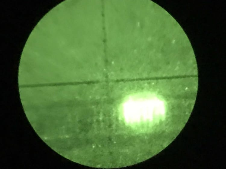 The optics of the PVS-14 were not designed to be viewed by a scope.