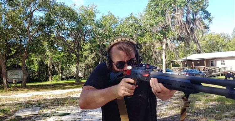 Benelli M4 shotgun red dot sight action shot 