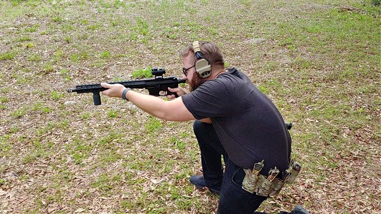 Travis Pike shooting a PCC and wearing a Sentry Gunnar belt.