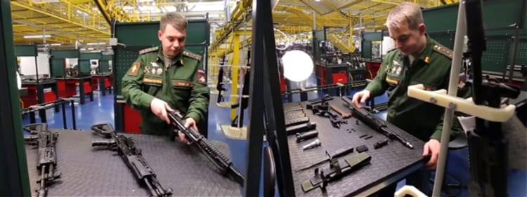 Military Liason Officer doing quality check on AK-12.