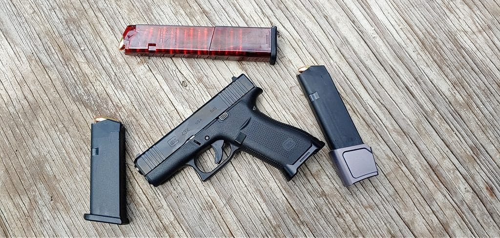 G43x with tyrant designs magwell, OEM magazine, extended magazine, and ETS magazine.