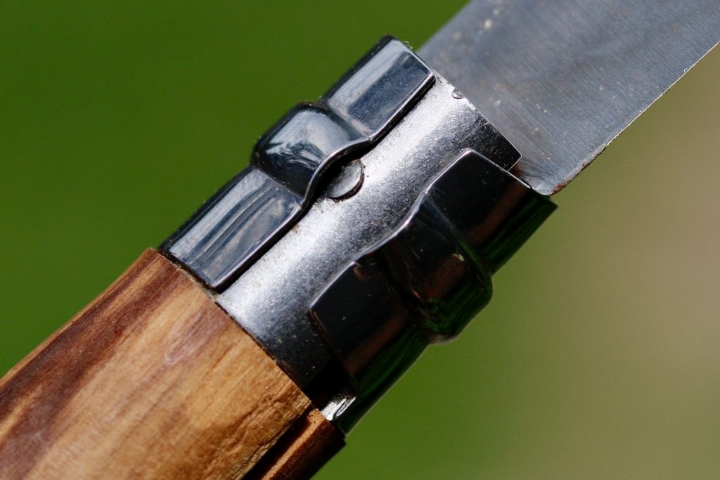 Notice how one side of the Opinel Virobloc lock is ramped. This is what adds the tension to keep it secure.