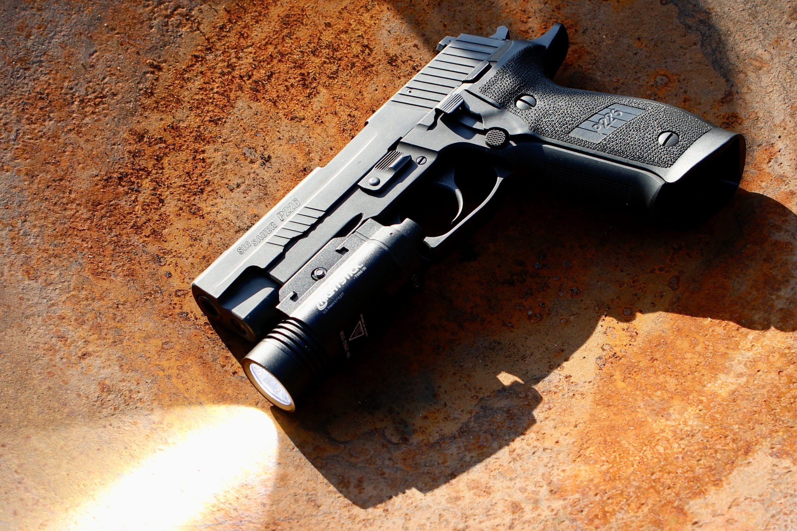 The Nightstick TMW-30 on a Sig Sauer P226.