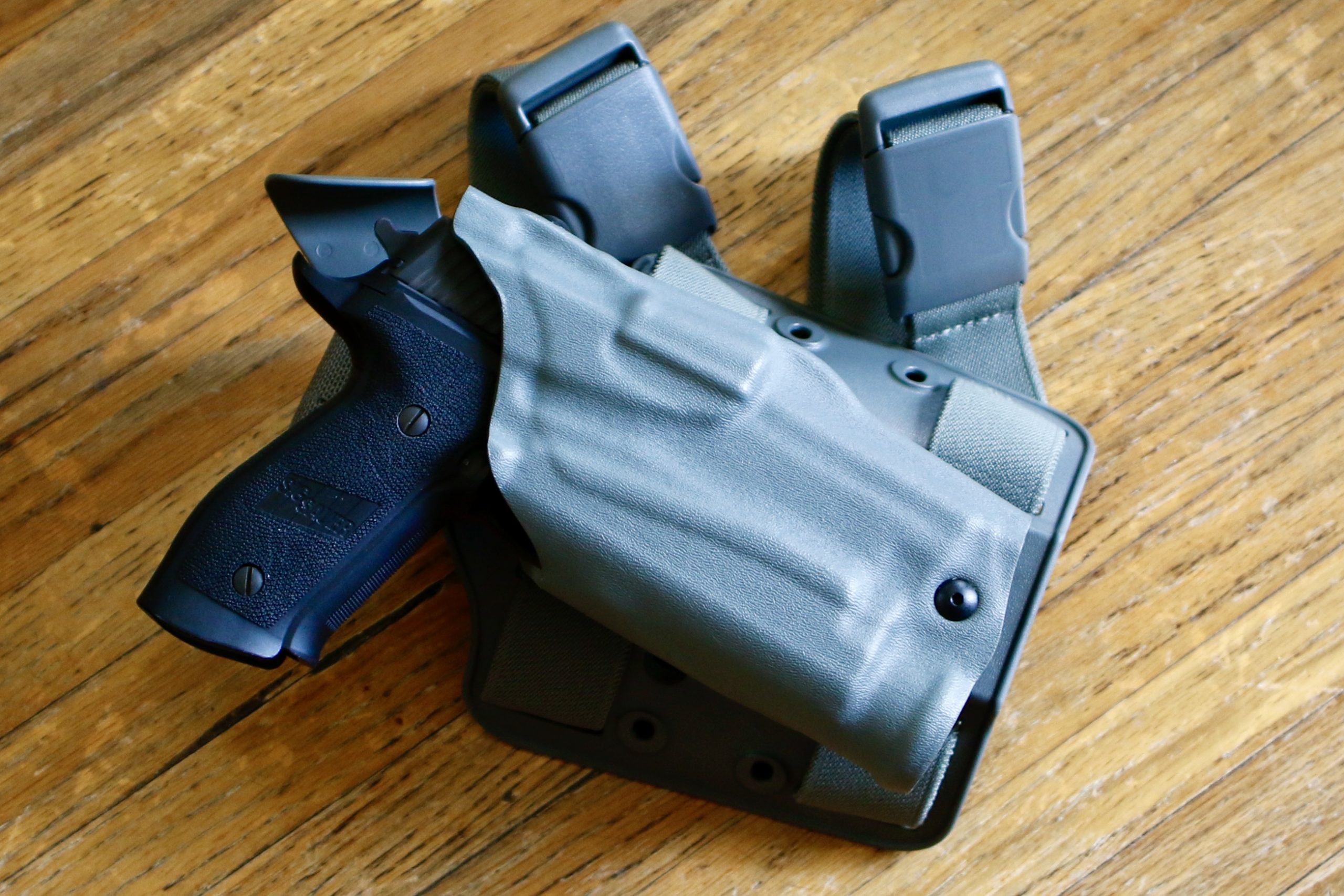 The TWM-30 will fit on a Sig P226 and both will fit into this Safariland drop-leg holster, which is built for the SureFire X300.