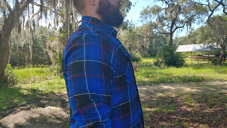 side profile showing how the Premier concealable armor vest doesn't add any bulk under a Dixxon tactical flannel shirt