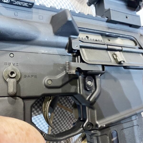 A close-up of the Colt M5's trigger guard.