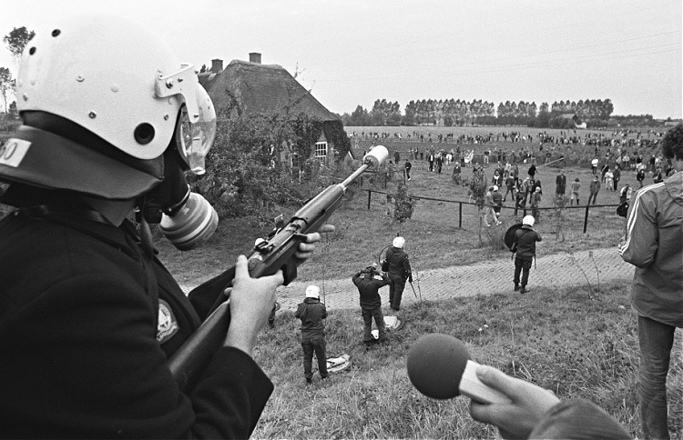 Dutch policeman shoots teargas at an anti-nuclear protest in 1981