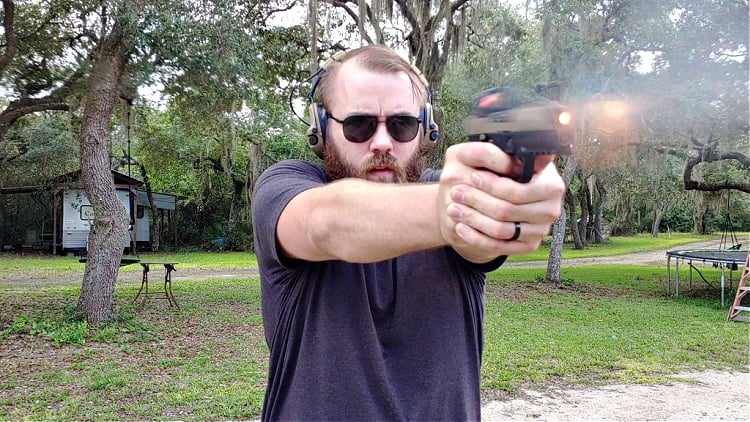 Travis Pike shooting the P320 fitted with the Amend2 s300 grip module. Image demonstrates his ability to maintain control even though the grip is small.