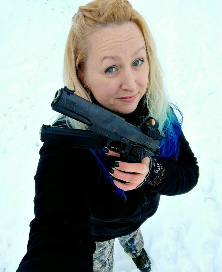Kat Ainsworth Stevens with a 10mm pistol