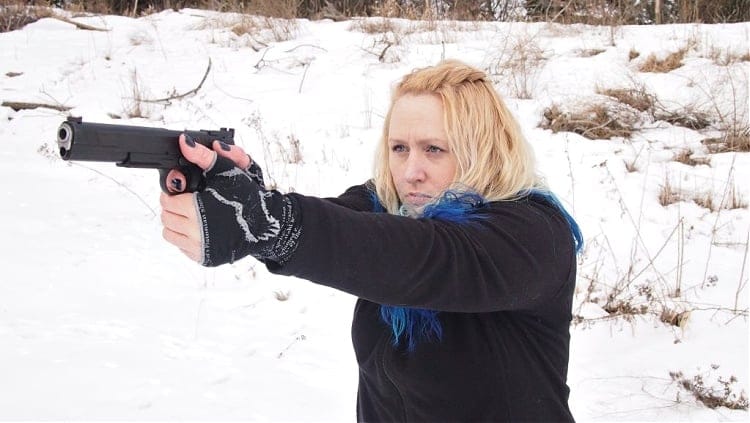 Kat Ainsworth Stevens with a 10mm pistol for self defense