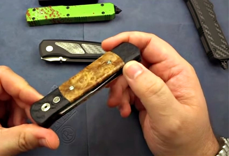 Protech Godson automatic knife with wood inlays and side-deploying blade.