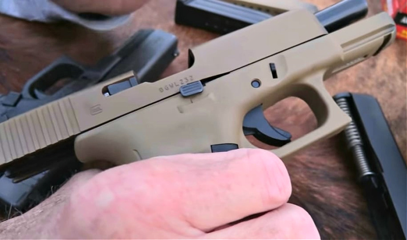 ambidextrous slide release and reversible magazine release