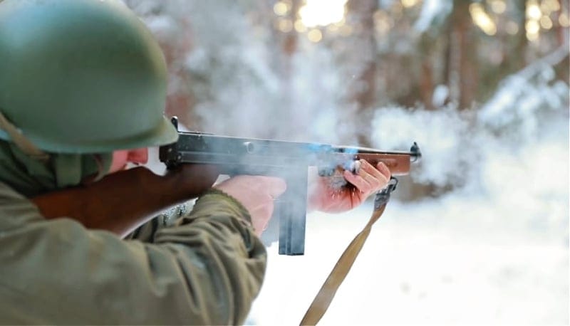 Soldier shooting the Thompson submachine gun