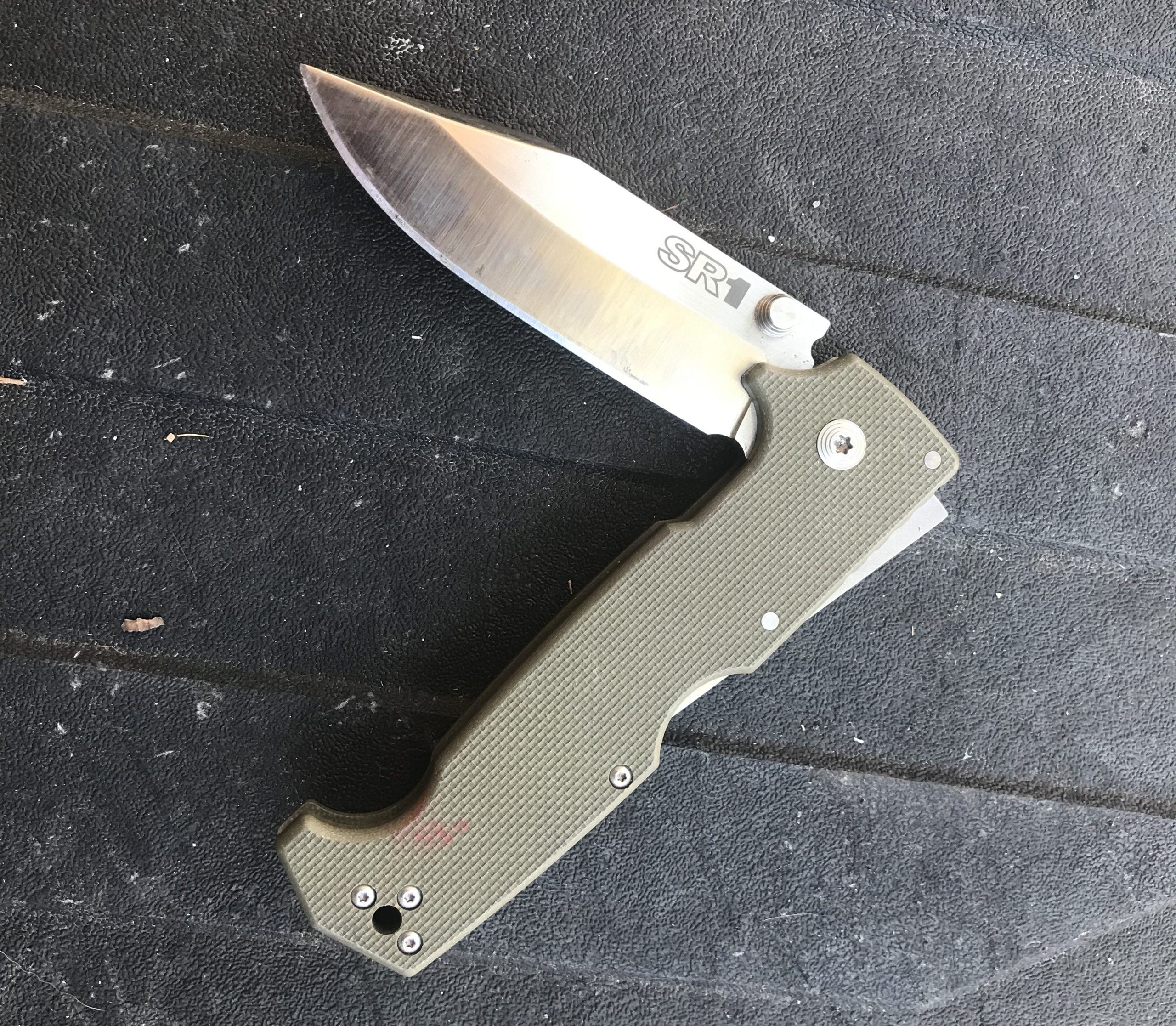 The Cold Steel SR1's blade is a solid 4 inch slab of 1/4" S35VN. This is a knife that is meant for hard use, but it isn't so big that it feels obtrusive in the pocket.