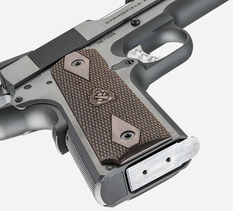 The Springfield Garrison 1911 has checkered thinline wood grips with a double-diamond pattern with the Crossed Cannon logo so shooters can maintain a grip even with wet hands