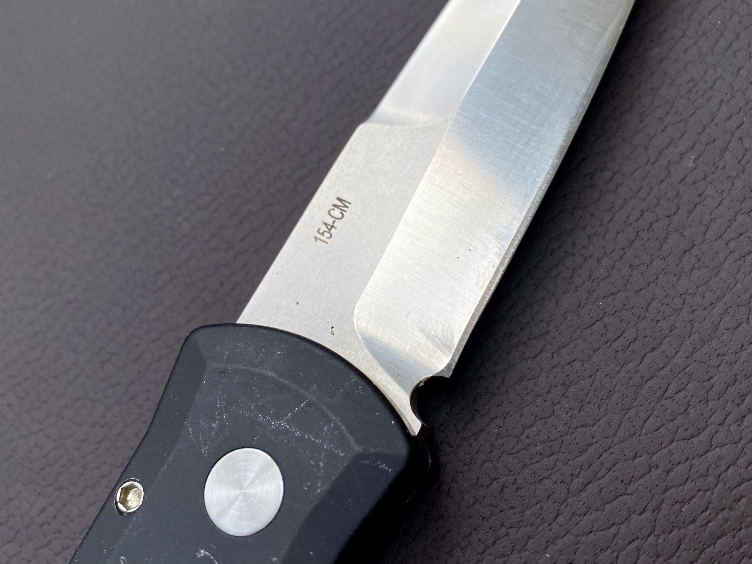 The Godfather is made from 154CM, a high carbon stainless steel. The edge retention is solid, but the blade has kept its shine nicely.