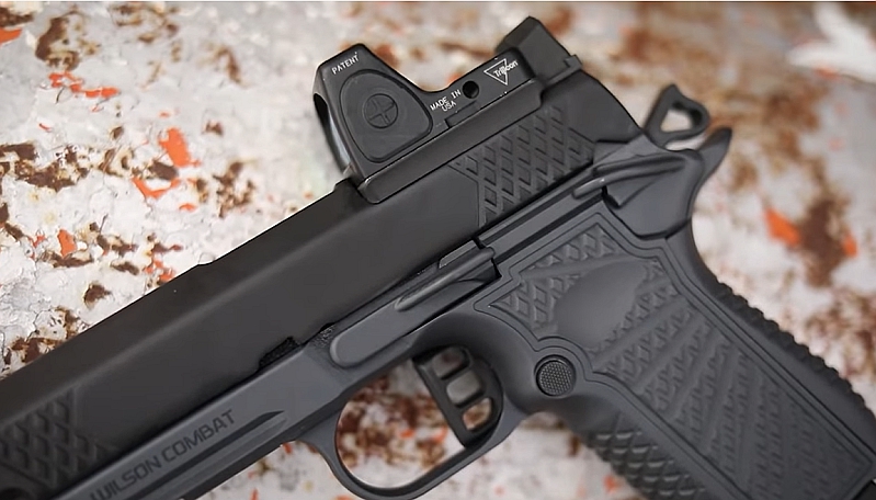 Wilson Combat SFX9 closeup of Bullet Proof safety, slide stop, and Trijicon RDS