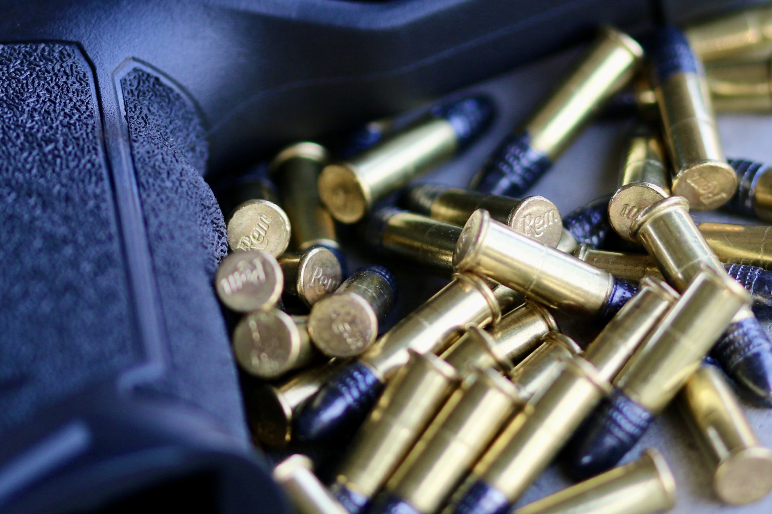 Remington .22 Thunderbolt cartridges piled next to Taurus TX22 