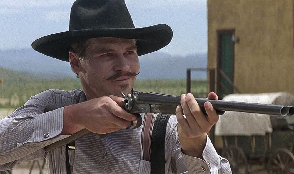 Val Kilmer as Doc Holiday with Street Howitzer in Tombstone