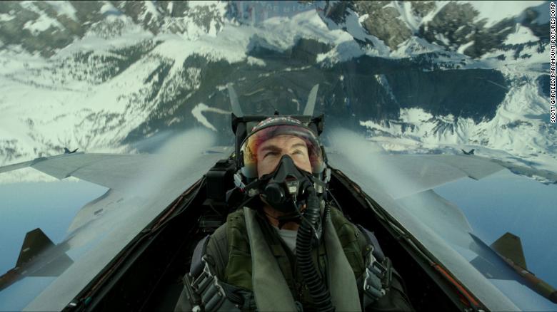 Tom Cruise in fighter jet cockpit, inverted