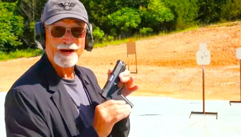 Ken holding the Wilson Combat pistol used in the 2-2-2 Skill Drill