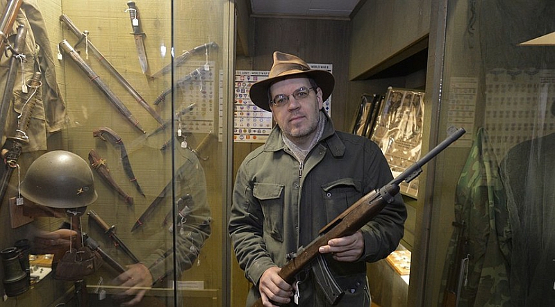 Stephen Hunter holding an M-1 Carbine 