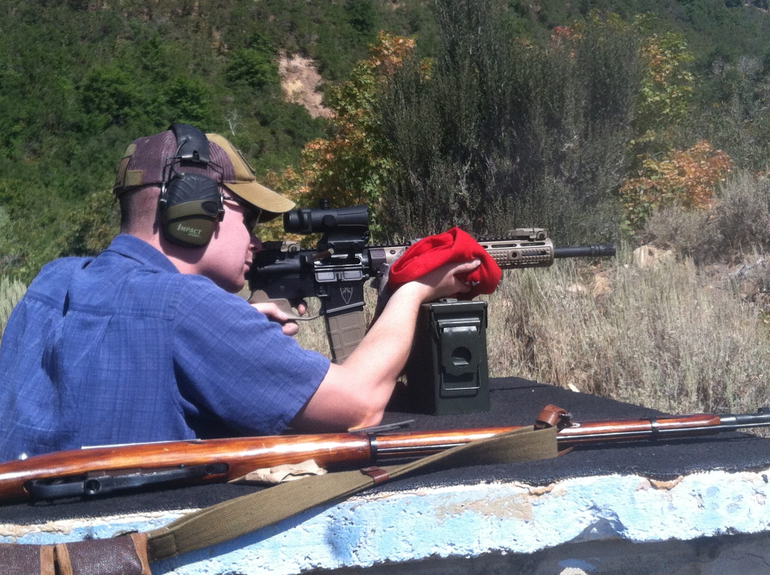 Shooting a rifle with a hot metal handguard