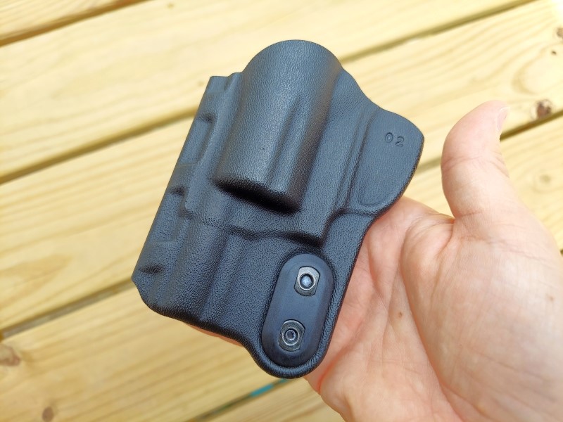The clip attachment screws can be seen at the lower right corner of the Slim Tuk SW 642 holster.