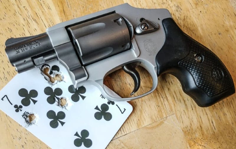 Smith & Wesson 642 Airweight and playing card used as target with bullet holes