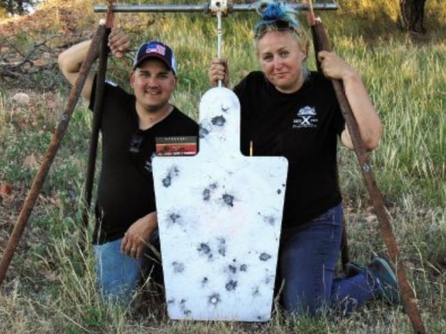 Kat Ainsworth Stevens and friend with a metal target on a range day