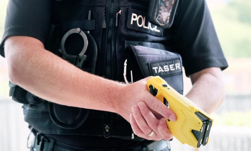Cop with a Taser.