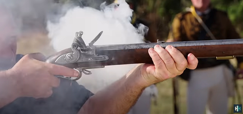 Historian Mike Loades fires a reproduction Baker Rifle.
