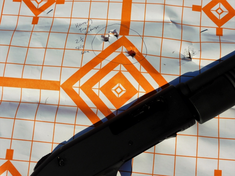 A pattern of buckshot on a paper target with the Mossberg 590.