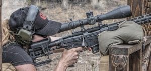 Woman shooting Ruger RPR from a rest.