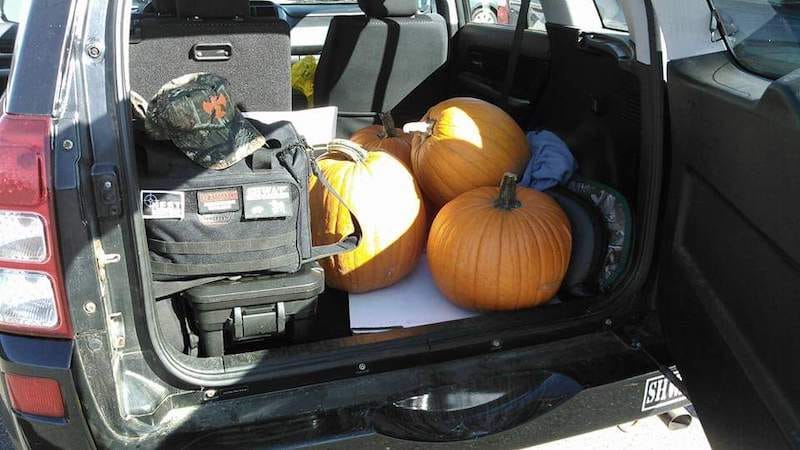 guns, ammo, and pumpkins loaded into car for shooting pumpkins