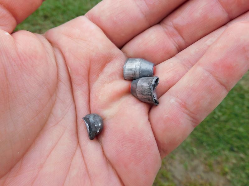 Two flattened slugs and a round ball recovered from the test.