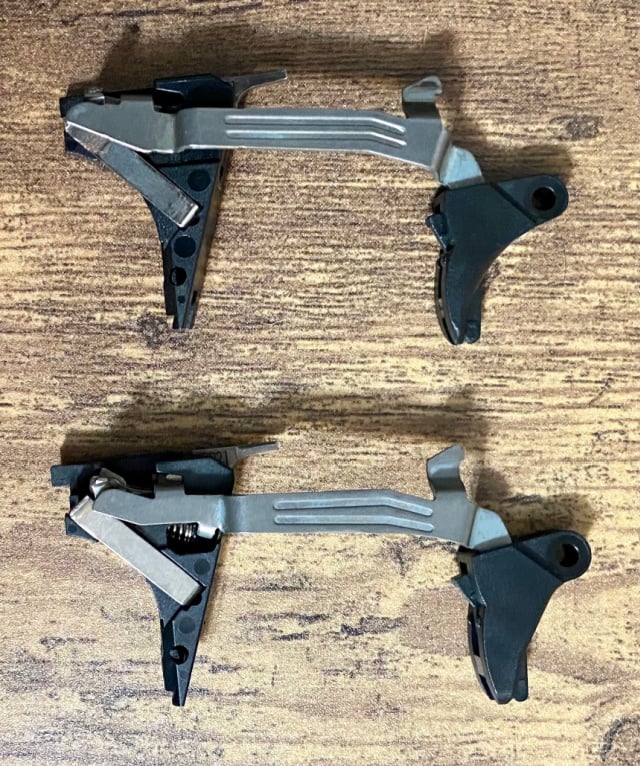 Comparing the Gen5 stock trigger (top) to the new Glock Performance Trigger (bottom). 