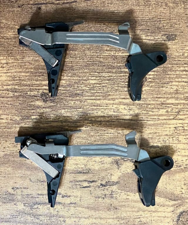 Comparing the Gen5 stock trigger (top) to the new Glock Performance Trigger (bottom).