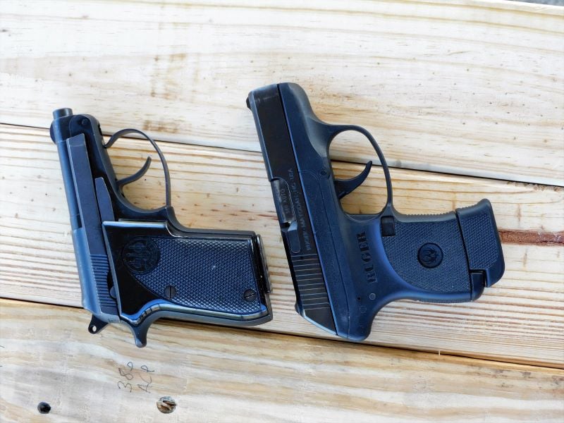 A Beretta Bobcat posed next to a Ruger LCP.