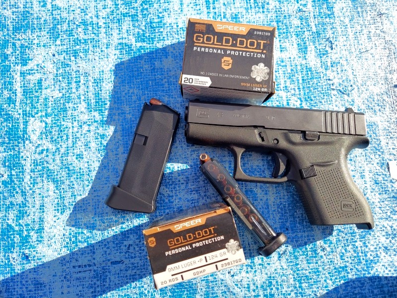 Glock 43 with spare magazines and Gold Dot hollowpoints.