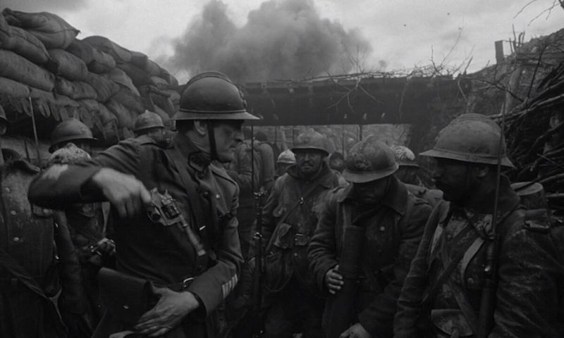 Paths of Glory movie - several soldiers talk and plan in the trenches of a war