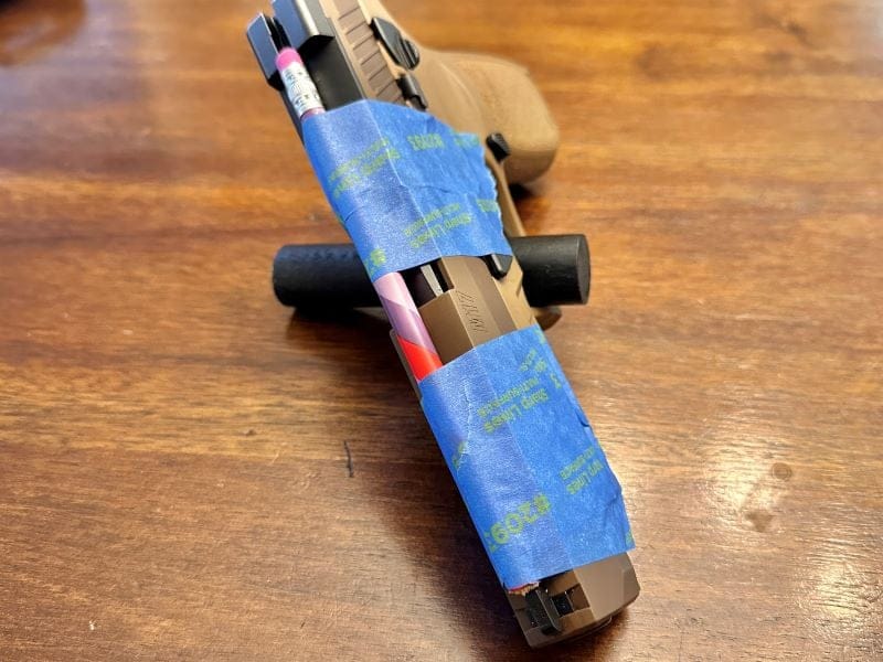 Adding a dowel to mold the area in a holster for the sights.