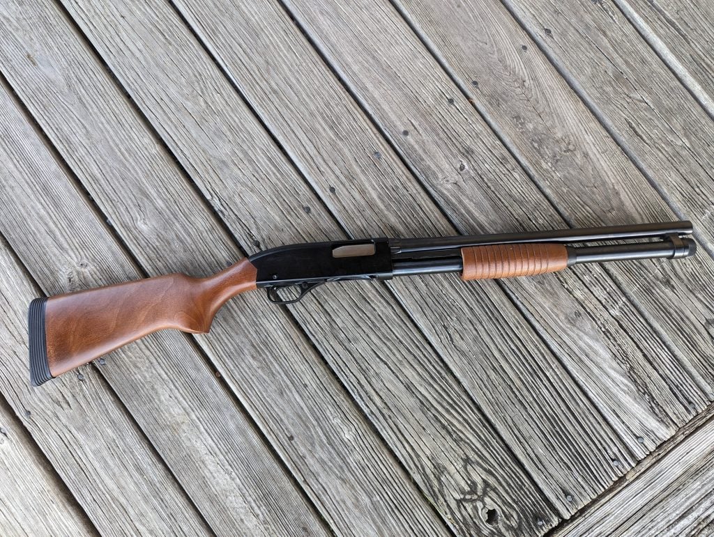 Winchester 1300 shotgun on wood