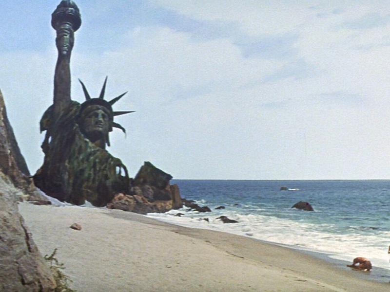 scene from Planet of the apes, person worshipping statue of liberty
