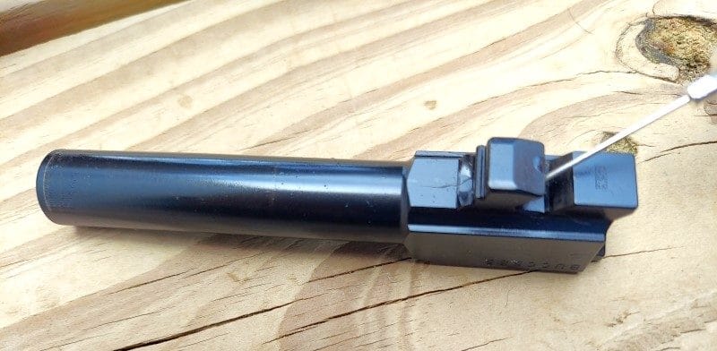 Striker-fired barrel geometry receiving lube.