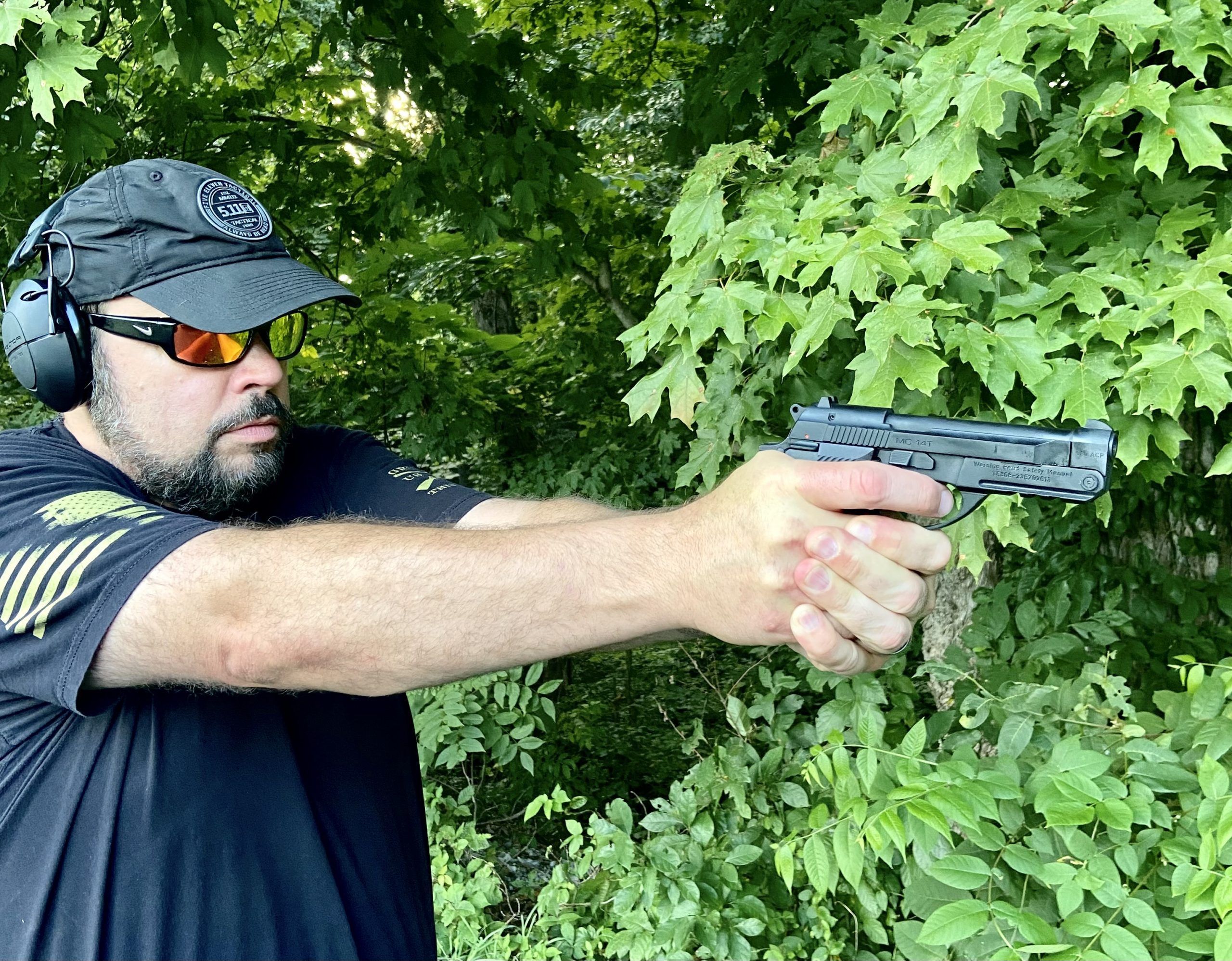man shooting a handgun