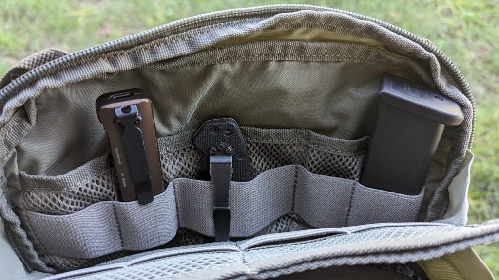 pocket with light, knife and magazine