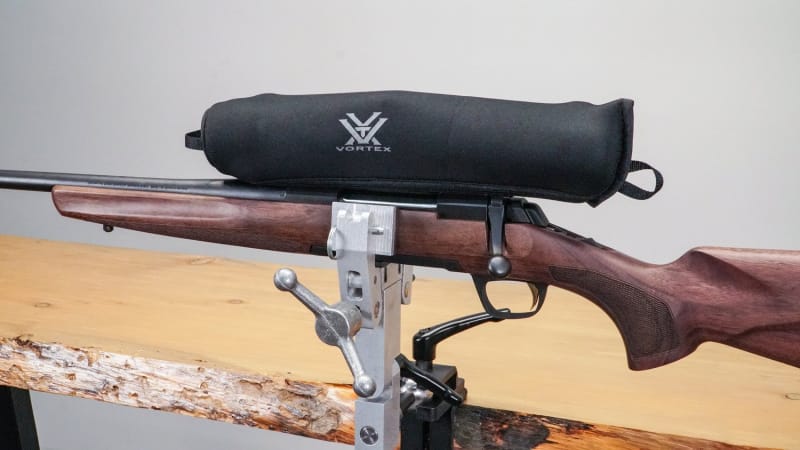 bolt-action rifle in vise